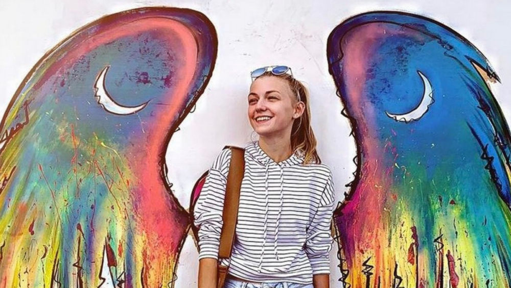 photo of Gabby Petito with a background of colored angel wings
